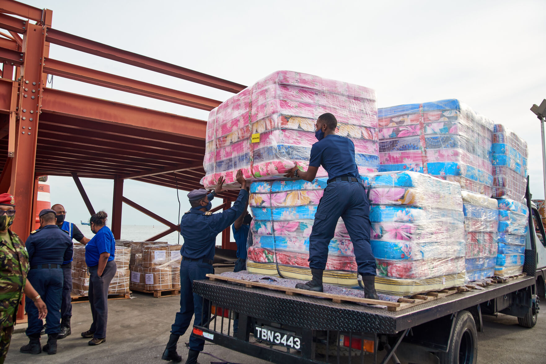 Angostura Members of the Coast Guard load mattresses onto a truck for.jpg